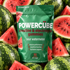 A green stand-up pouch of POWERCUBE creatine & electrolyte gummies, labeled sour watermelon, surrounded by fresh watermelons and watermelon slices.